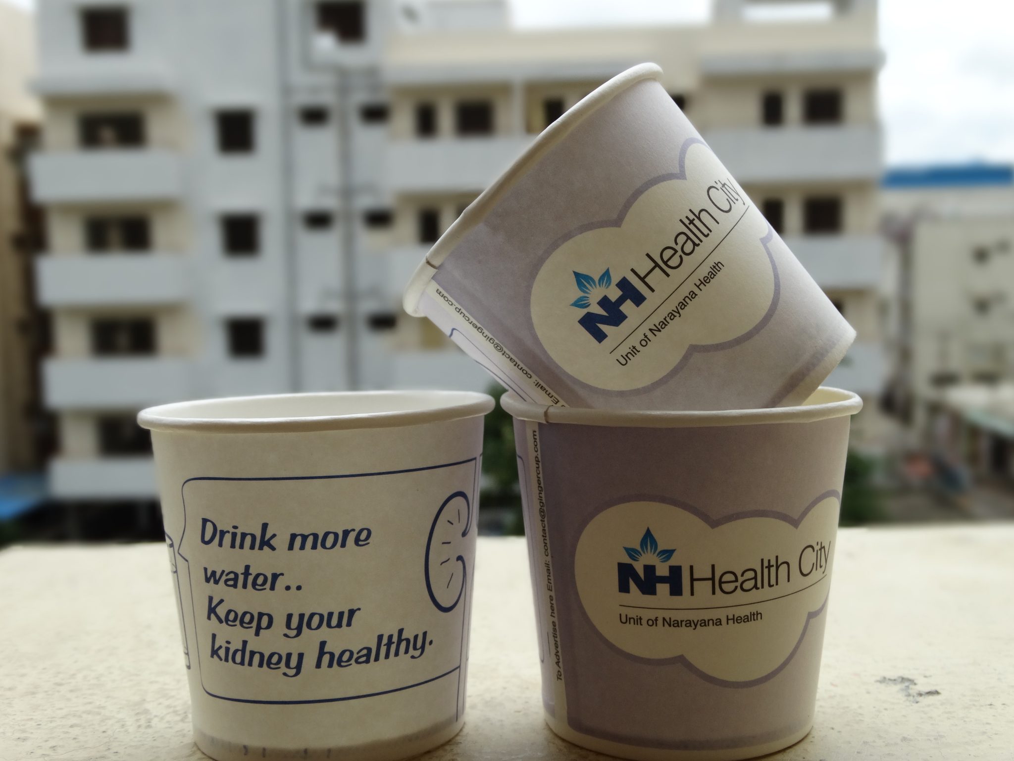 NH health city hospital marketing paper cup branding for Dental Practice