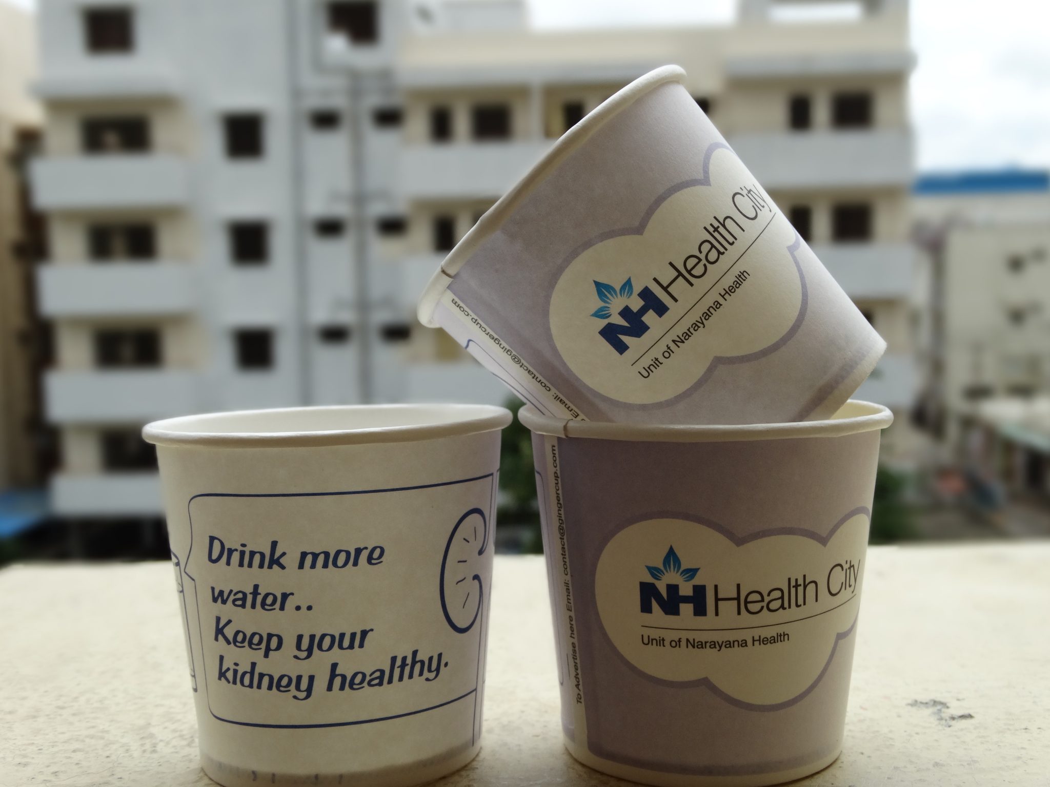 NH health city hospital marketing paper cup branding for Dental Practice